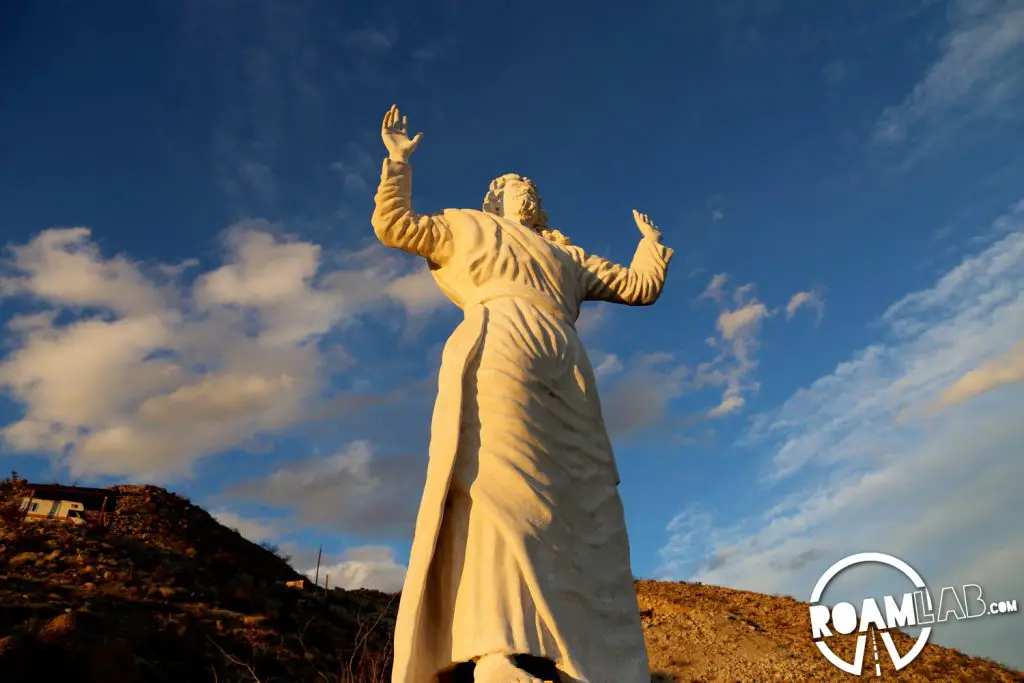 This displaced Jesus was originally intended to be perched on the Grand Canyon. Without the needed permission to place it where he pleased, artist Frank Antone Martin agreed to bring the oversized savior to this desolate mountain side.