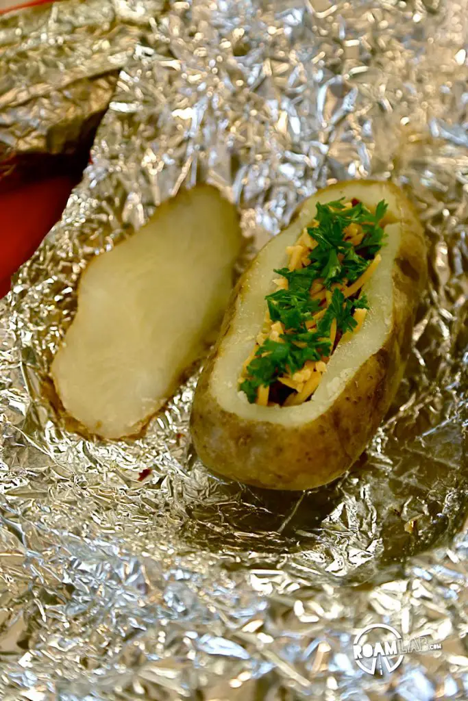 Stoke up that fire for an amazingly delicious Hiker's Bacon And Egg Potato Boat Breakfast