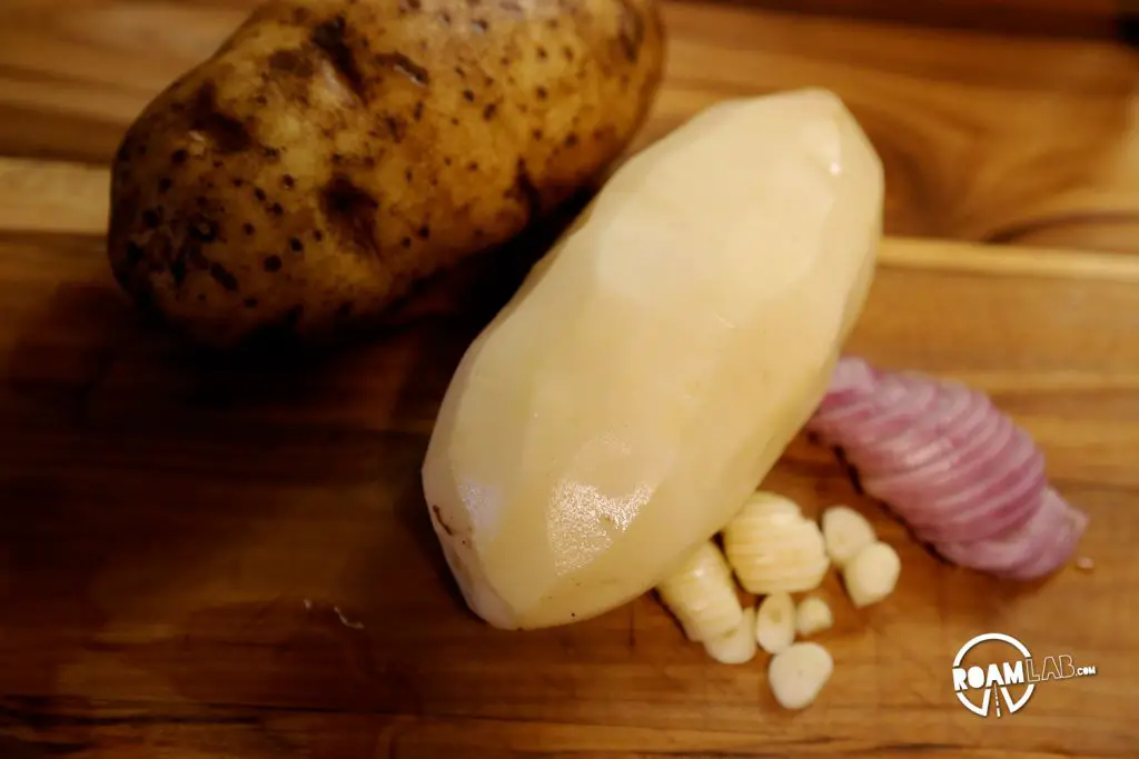 Potatoes, garlic, and scallions for Tinfoil Scalloped Potatoes.