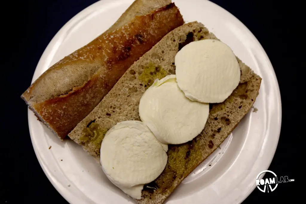 Fresh Mozzarella on a baguette. The making of a delicious Class in the Campground Prosciutto Mozzarella Sandwich.