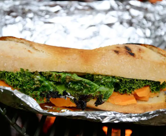 A vegetarian-friendly sandwich for the campfire: Grilled Sweet Potato, Kale, & Goat Cheese Baguette