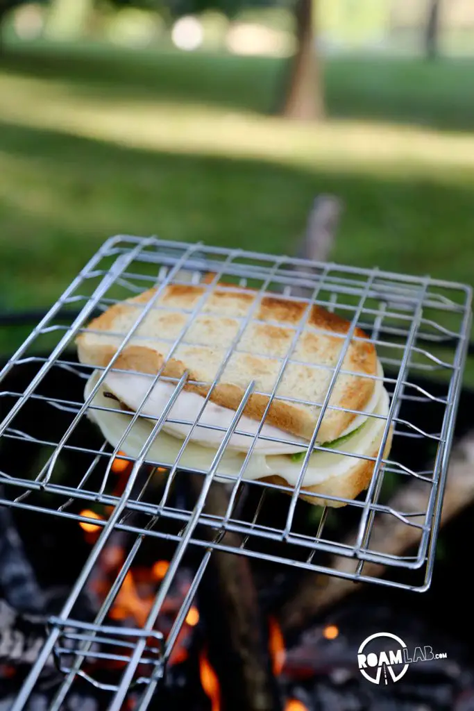 Grilling the Camper’s Club Sandwich, the only way that's right: over the fire.