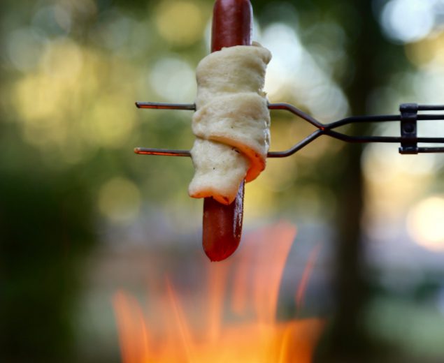 The Spit Fire Hotdog Wrapped In Pastry is the ultimate compromise between a lazy and a lavish campfire dinner recipe. You can keep it simple or add any and all twists to make it the perfect expression of you...for your tummy.