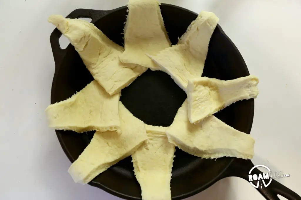 We had a left over tube of crescents and slices of ham, so we decided to bring those two together to make a fun and tasty breakfast combo: the  Dutch Oven Breakfast Ring