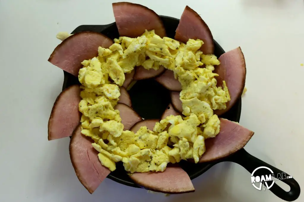 We had a left over tube of crescents and slices of ham, so we decided to bring those two together to make a fun and tasty breakfast combo: the  Dutch Oven Breakfast Ring
