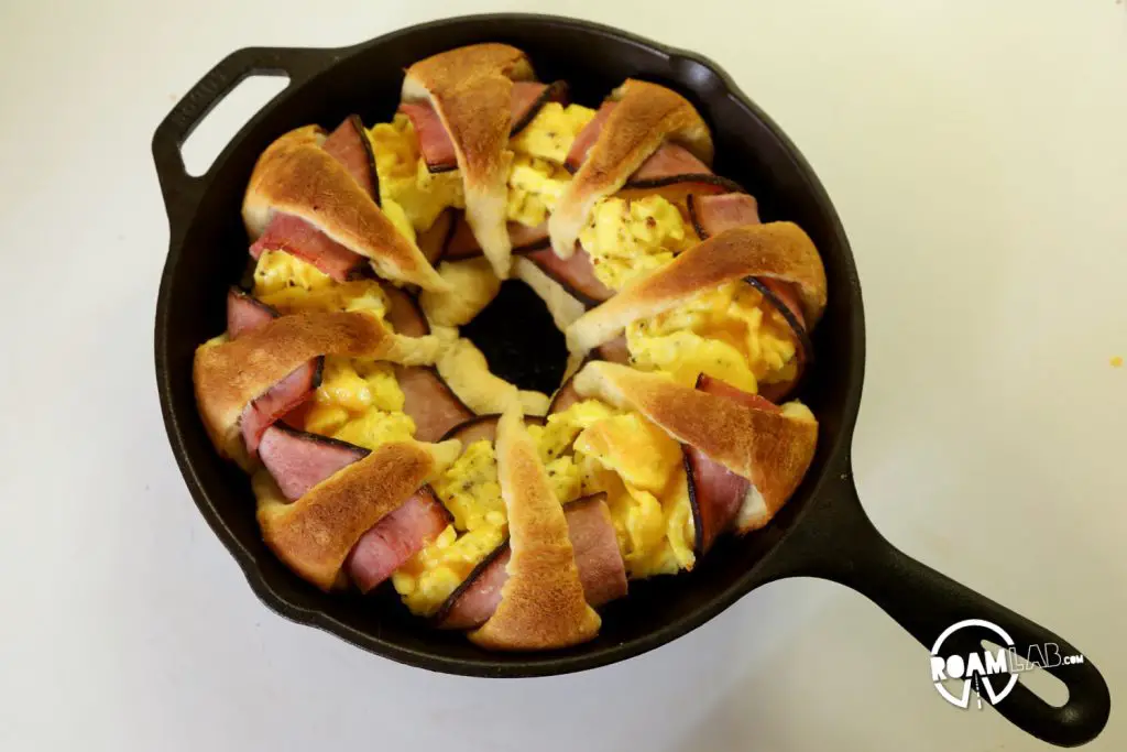 We had a left over tube of crescents and slices of ham, so we decided to bring those two together to make a fun and tasty breakfast combo: the  Dutch Oven Breakfast Ring