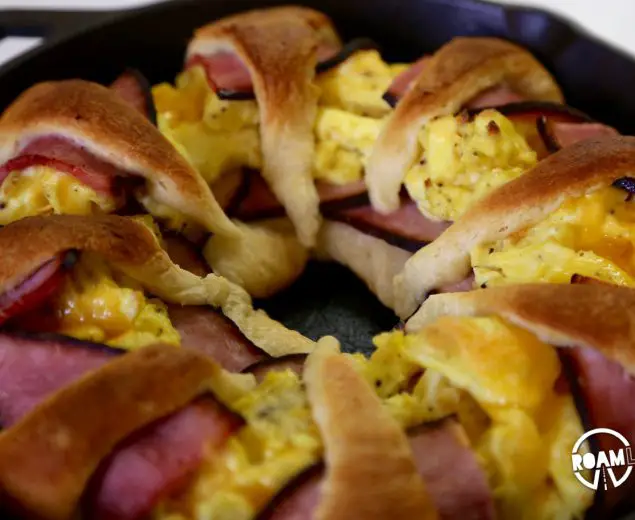 We had a left over tube of crescents and slices of ham, so we decided to bring those two together to make a fun and tasty breakfast combo: the Dutch Oven Breakfast Ring