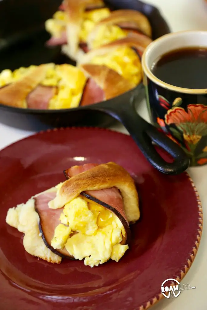 We had a left over tube of crescents and slices of ham, so we decided to bring those two together to make a fun and tasty breakfast combo: the Dutch Oven Breakfast Ring