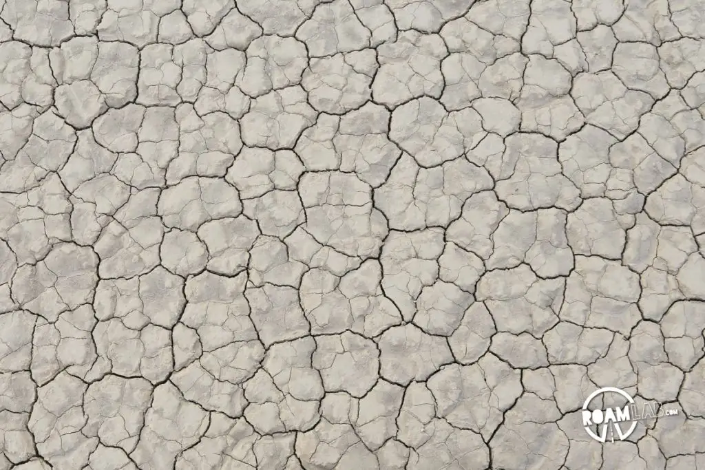 The road to the Racetrack Playa in Death Valley National Park is one long, brutal washboard past volcanic craters, Joshua Trees, and teakettles to a dry lakebed punctuated by a grandstand rock formation and sailing stones.