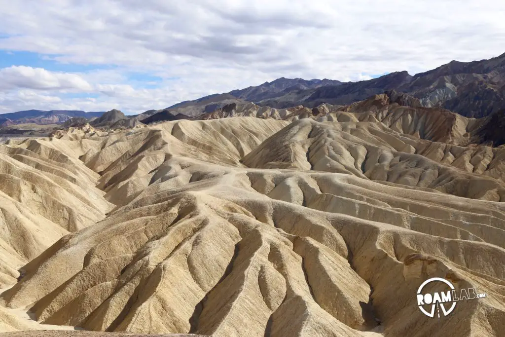 The land around Zabriskie Point drapes like fabric settling over a hidden structure.