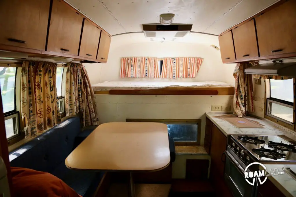 Interior view facing the bed of a 1970 Avion C11 truck camper.