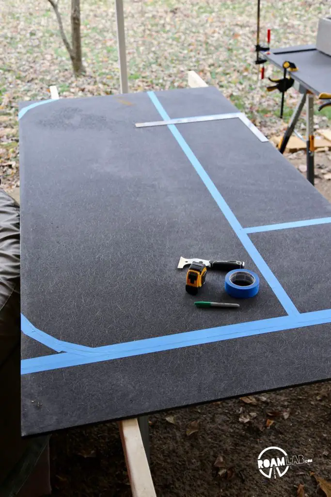 Outlining the entry section of the truck camper's floor where the rounded corners add support and structure to the rounded aluminum walls.
