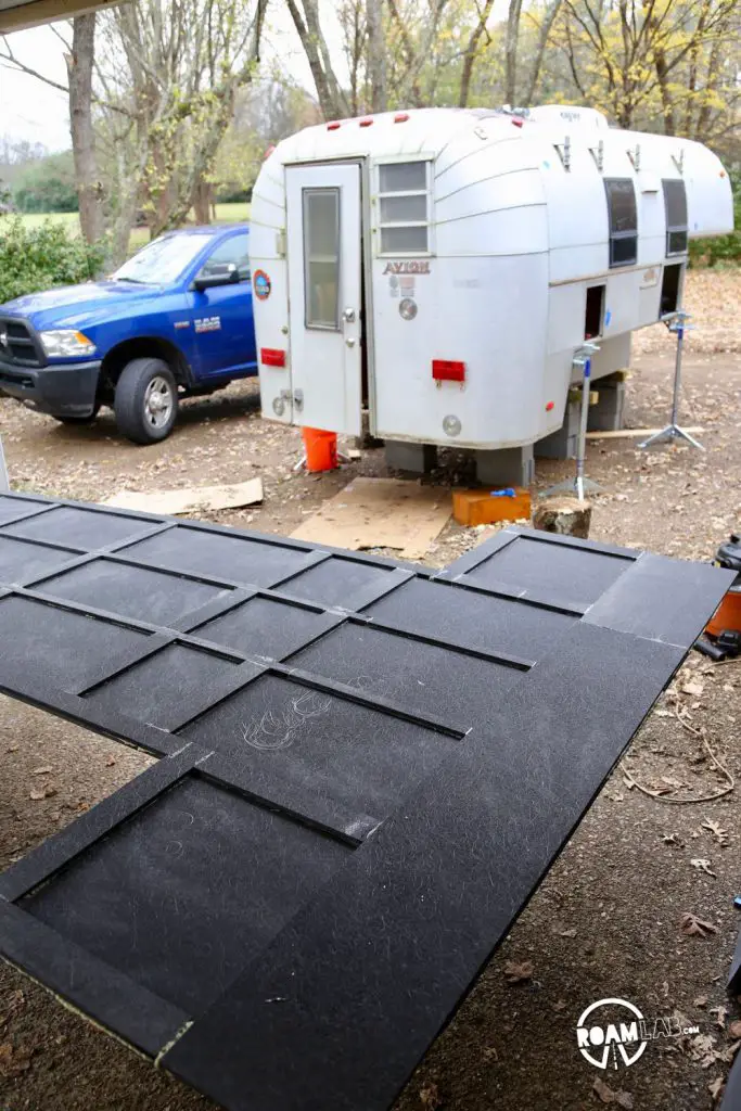 The central layer of fiberglas composite is complete, creating the skeleton which will now be filled with foam board and then covered with another layer of fiberglas composite.