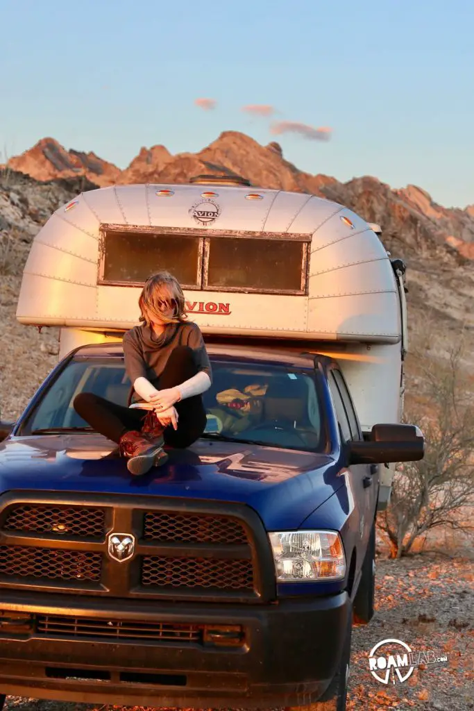 Relaxing on our Avion truck camper and watching the sunset in the Cargo Muchacho Mountains