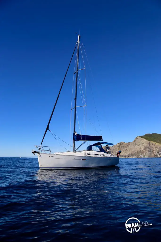 Sailing to Whangamumu Harbour from Motuarohia Island via "The Hole In The Rock” on Motu Kōkako (aka Piercy Island), New Zealand.