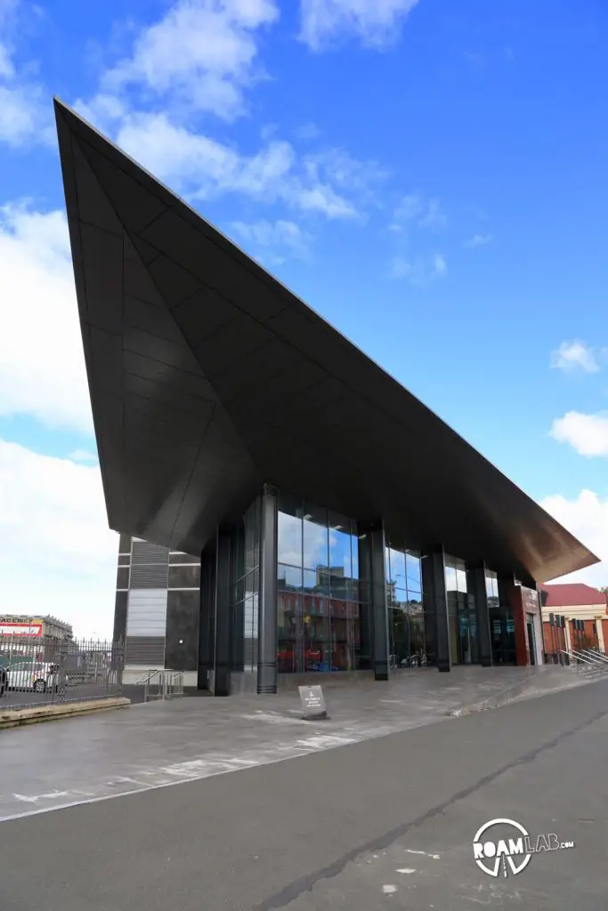 Wander a farmers market at the Dunedin railway station, explore Toitū Otago Settlers Museum, and spot blue penguins at the Royal Albatross Centre around Dunedin, New Zealand.