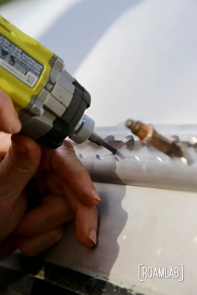 Drilling the mount hole. For this rivet to work, we not only need to drill the hole for the rivet's shaft but also use a countersink bit so that the rivet sits flush with the surface.