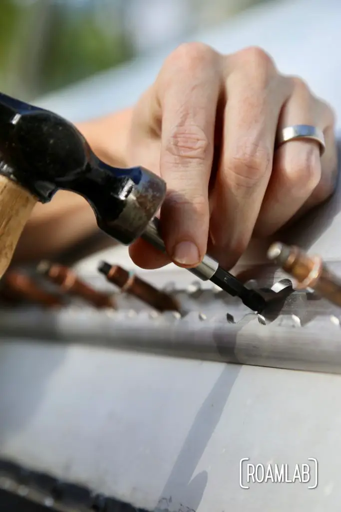 With everything else out of sorts, the air hammer (or rivet gun) will be too difficult to wield, so we are riveting the old fashioned way when installing a rail on a vintage 1970 Avion C11 truck camper.