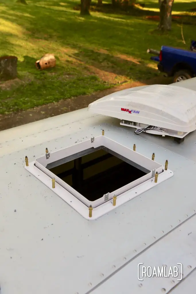 Clecos holding fan frame in place for a DIY MaxxAir Fan installation.