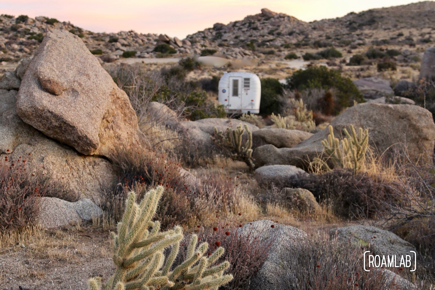 Sunrise over an Avion C11 truck camper boondocking in the Culp Valley Primitive Campground of Anza Borrego Desert State Park.