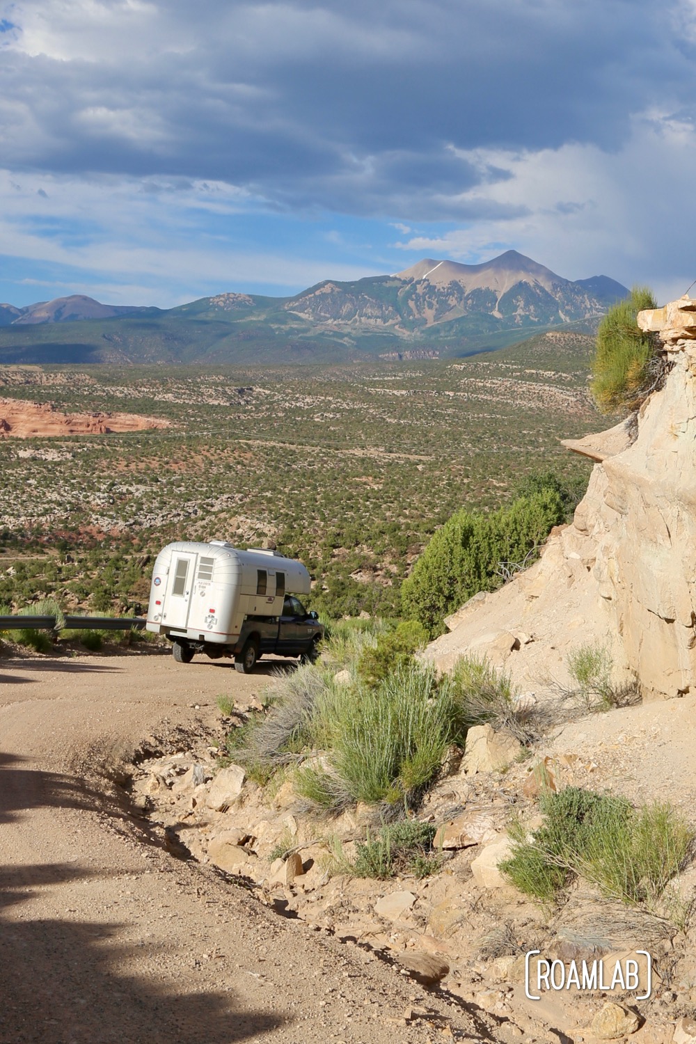 Truck camper driving down the dirt roads outside Moab, Utah.