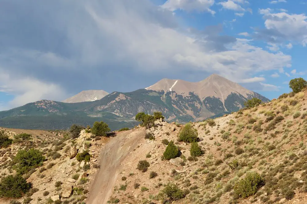 Steep dirt trail to a mountain