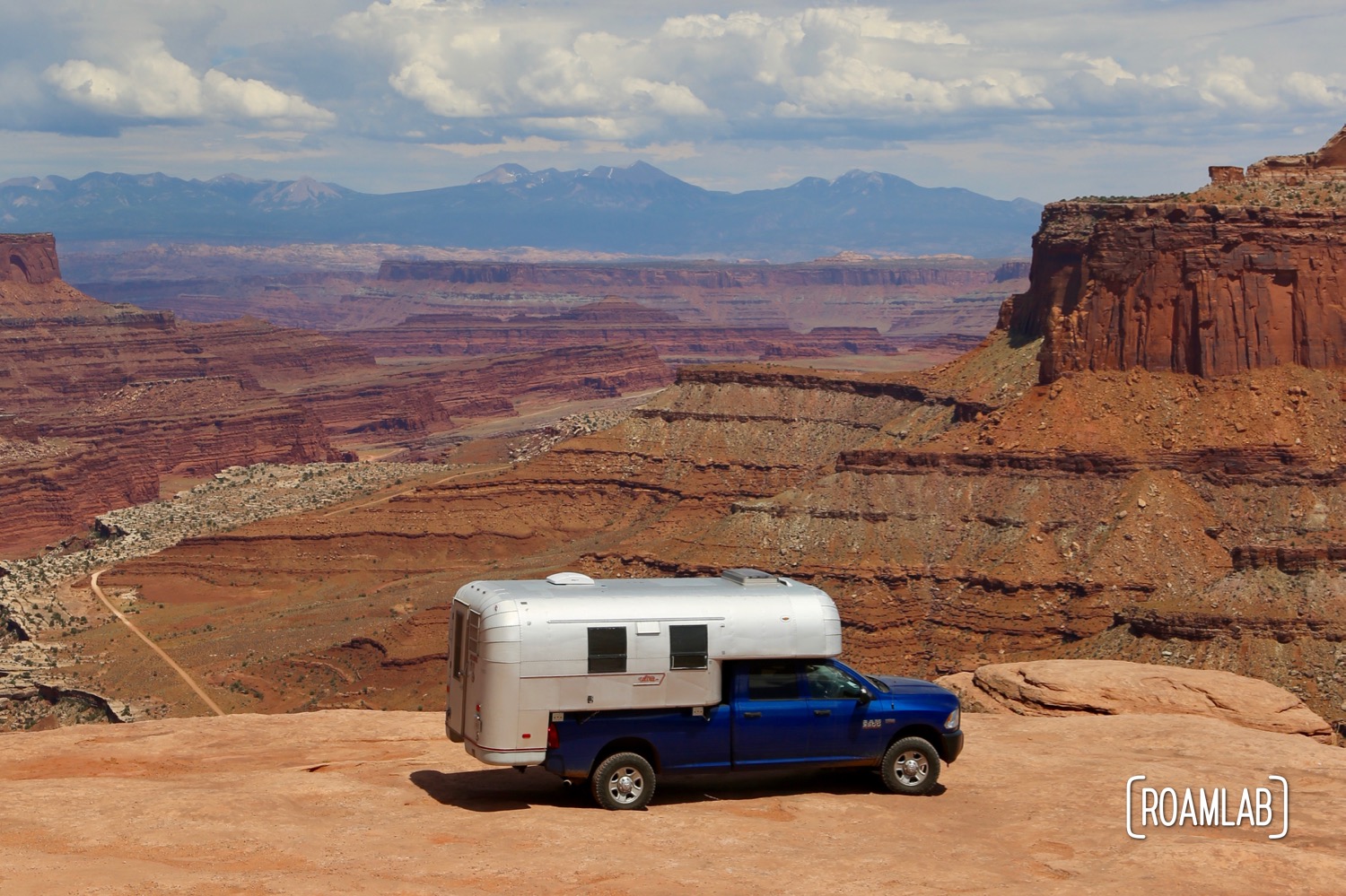 1970 Avion C11 truck camper parked on overlook in Canyonlands National Park