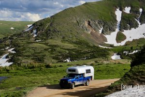 1970 Avion C11 Truck Camper driving among the glaciers on Old Fall River Road in Rocky Mountains National Park