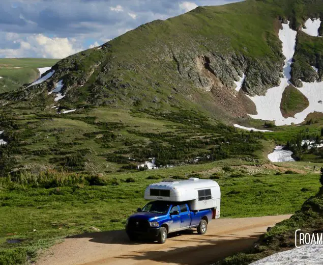 1970 Avion C11 Truck Camper driving among the glaciers on Old Fall River Road in Rocky Mountains National Park