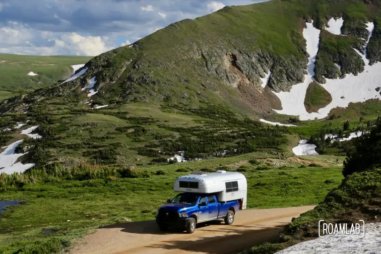 1970 Avion C11 Truck Camper driving among the glaciers on Old Fall River Road in Rocky Mountains National Park