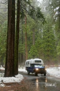 Hiking the North Grove Trail in the snow of Calaveras Big Trees State Park in the Sierras outside of Murphys, California and Highway 49.