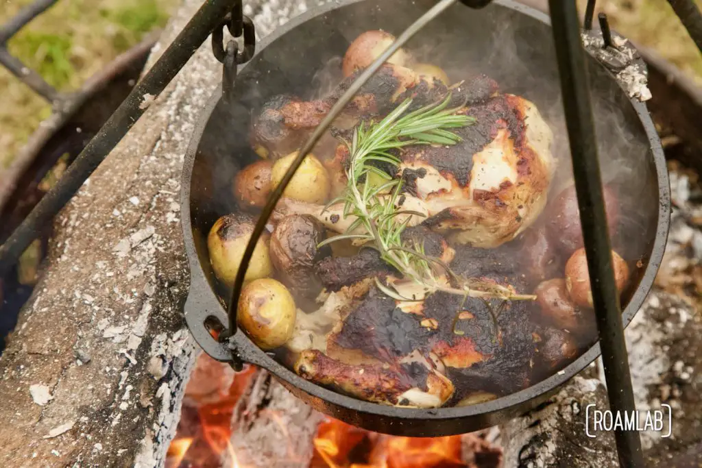 Roast this rosemary cornish game hen and potatoes recipe in a dutch oven over an open camp fire for a classy campground dinner or in your oven at home.