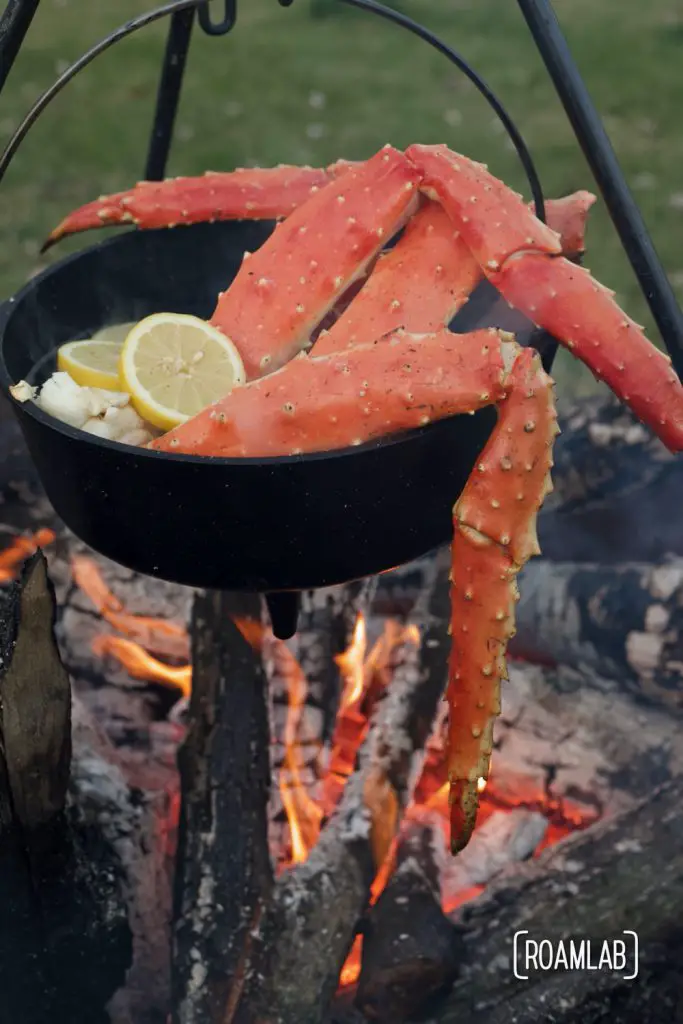 King Crab boiling in a cast iron dutch oven over a campfire