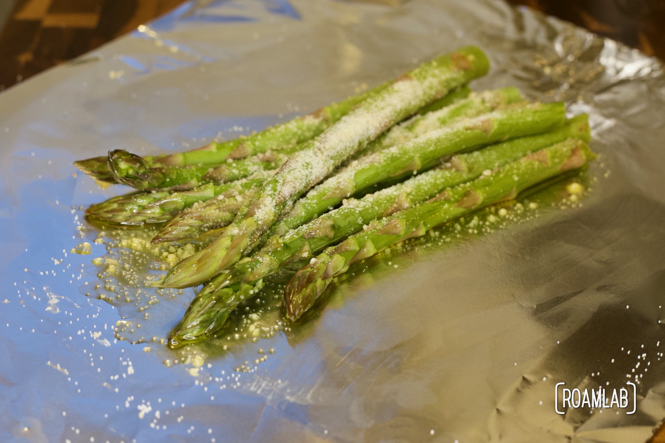 Savor a bundle of tasty vegetable spears on your next camping trip with this tin foil parmesan asparagus campfire cooking side dish recipe.