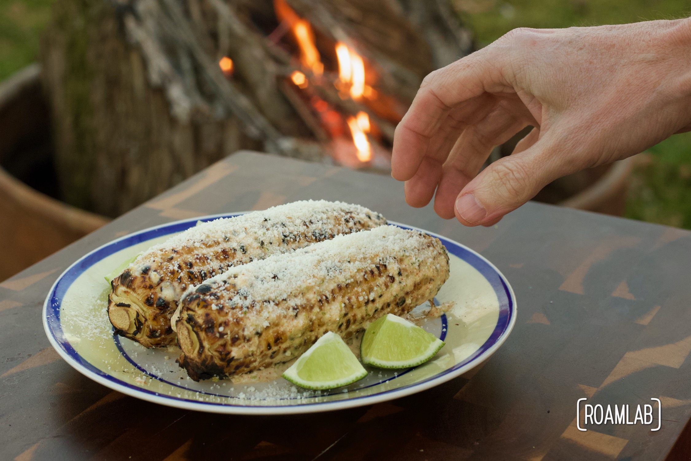 Enjoy this Mexican street corn campground noshing delight: tin foil elote campfire cooking appetizer recipe with cotija cheese, chili powder, and lime.