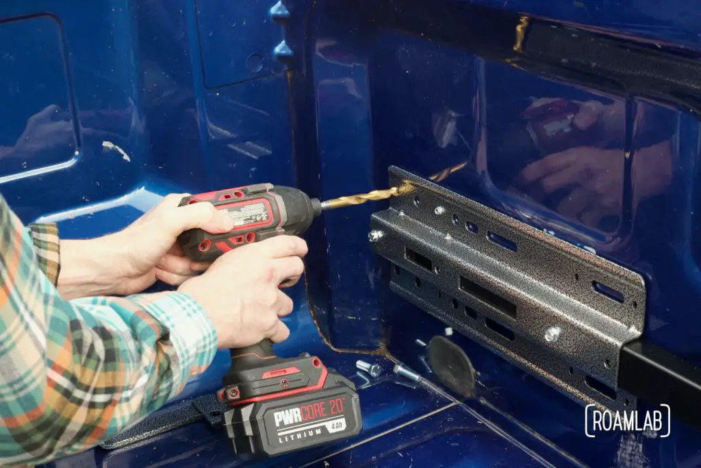 Drilling 7/16" holes to bolt the front anchor plate to the guide plate.