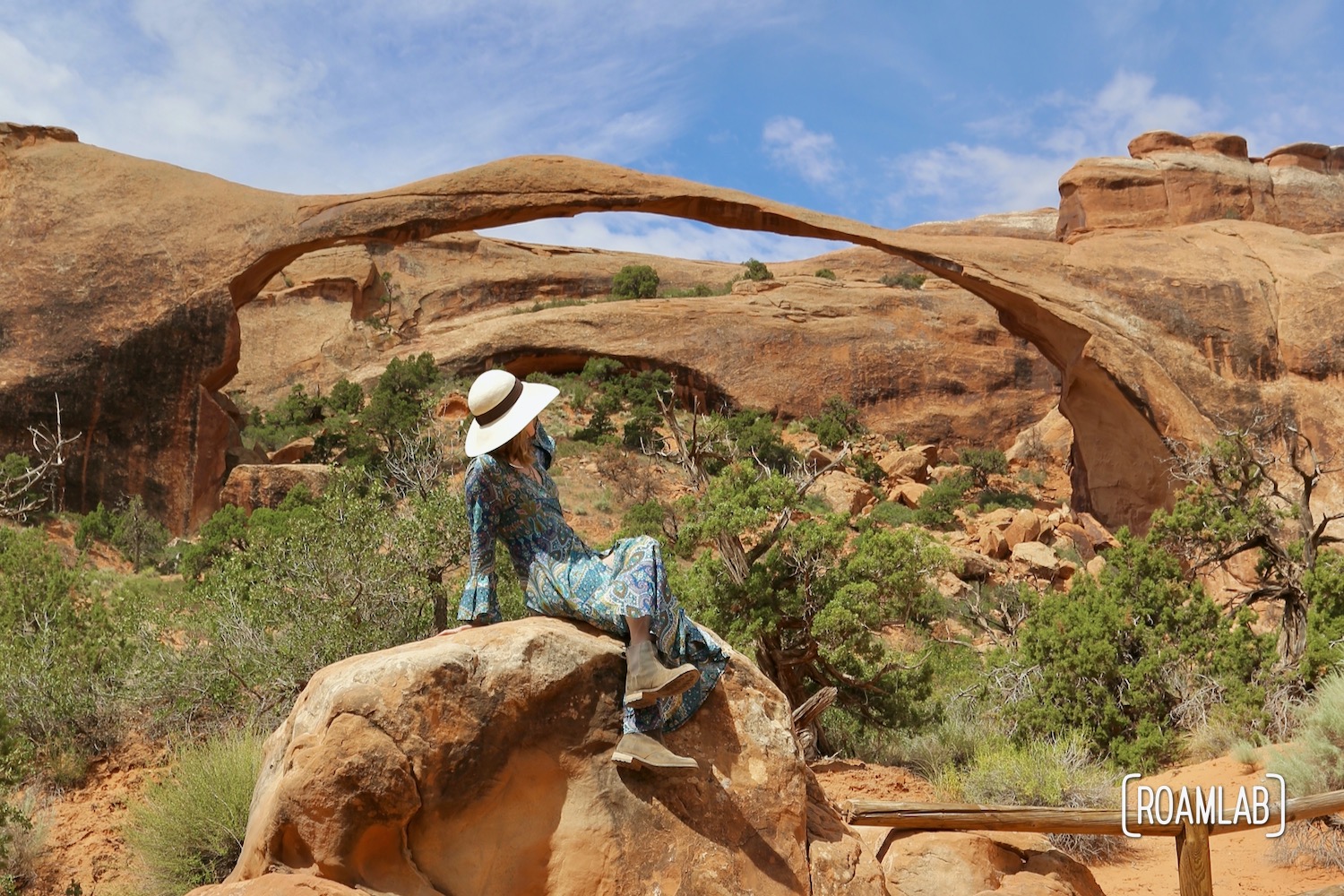 Woman in front of Landscape Arch in the Devil's Garden of Arches National Park, Utah.