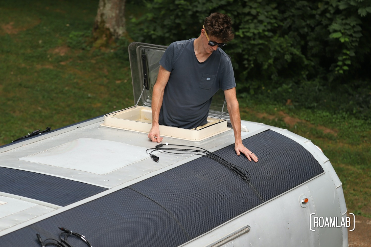 Test fitting solar panels on a 1970 Avion C11 truck camper roof.