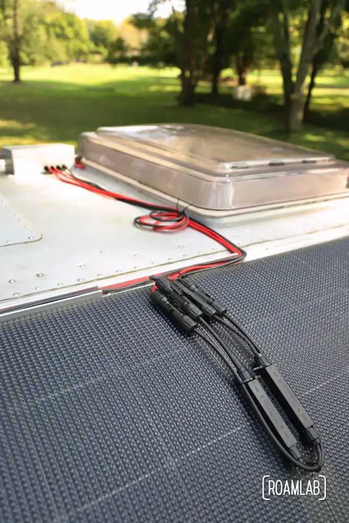 Routing wires from solar panel to junction box.