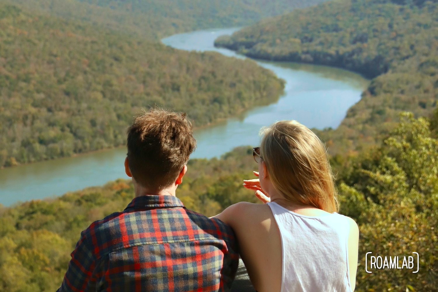 Man and woman looking out over the Tennessee River Gorge of Prentice Cooper State Park from Snoopers Rock.