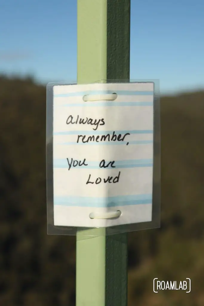 Laminated message tied to Foresthill Bridge: "Always remember, You are Loved"