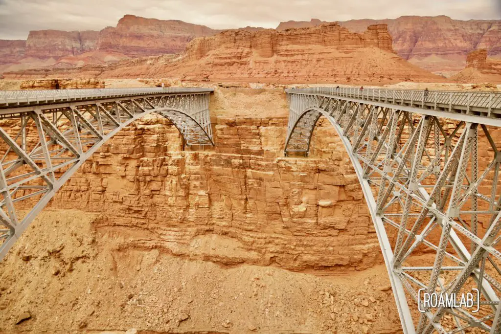 Two bridges crossing the gold cliffs of Marble Canyon and the Colorado River.