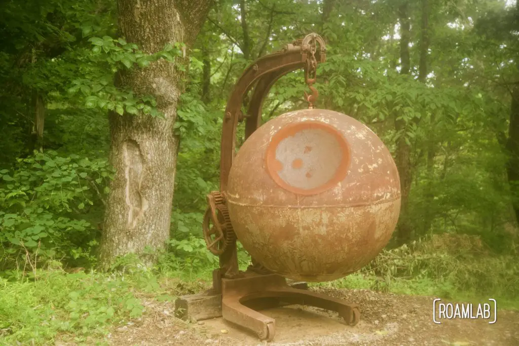 Welded sculpture resembling a suspended Death Star at Crystal Onyx Cave.