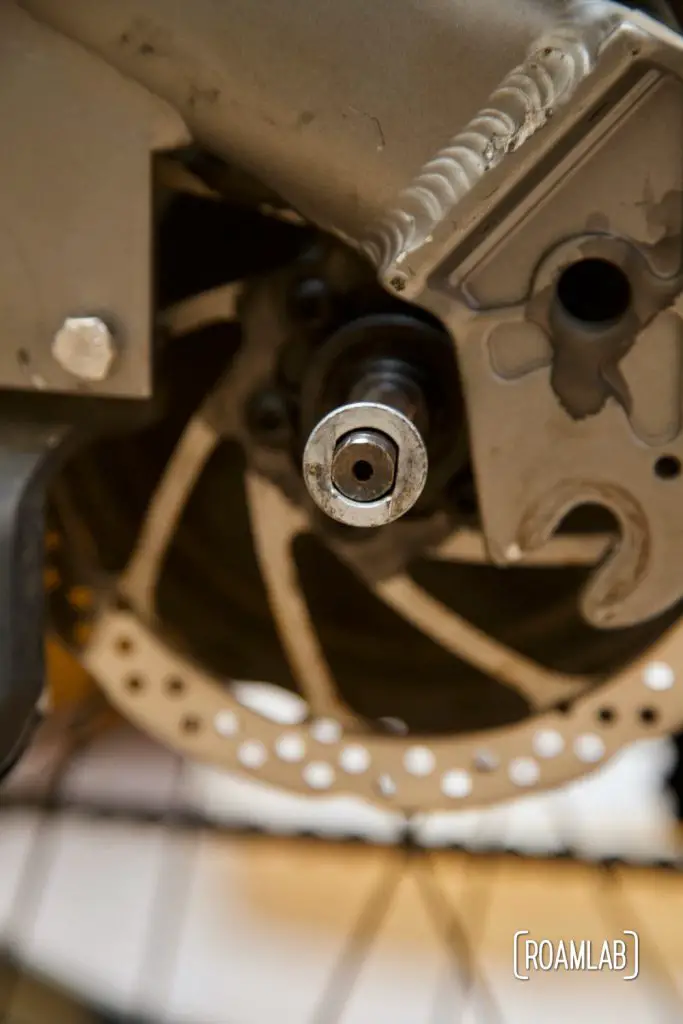 Closeup view of torque washer on rear axle.