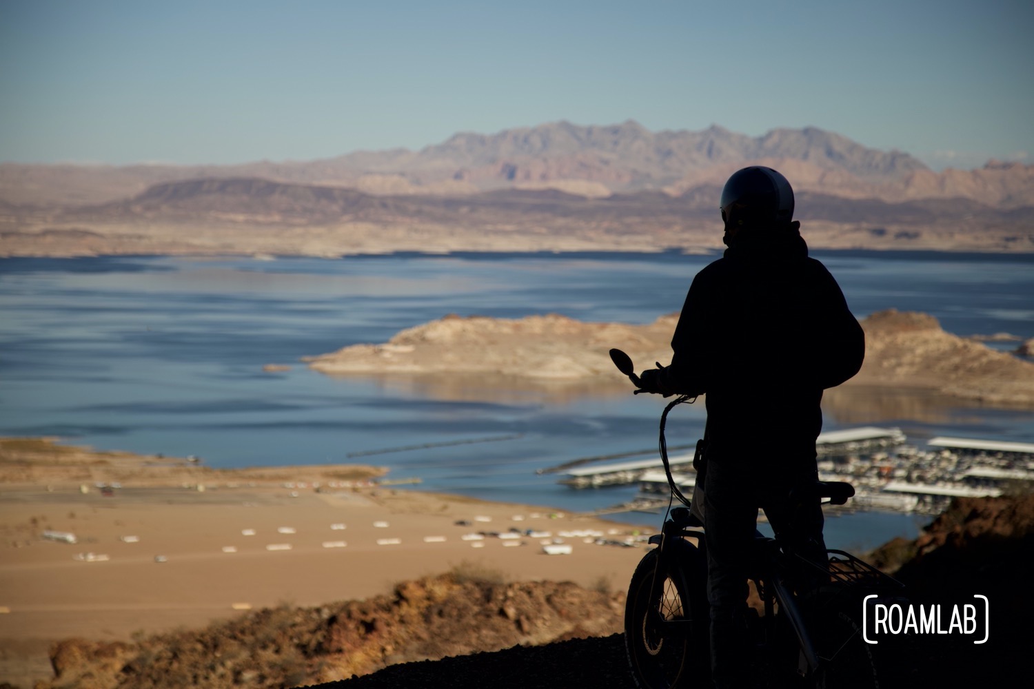 Man astride a bike on an overlook from Tunnel Trail in Lake Mead National Recreation Area.
