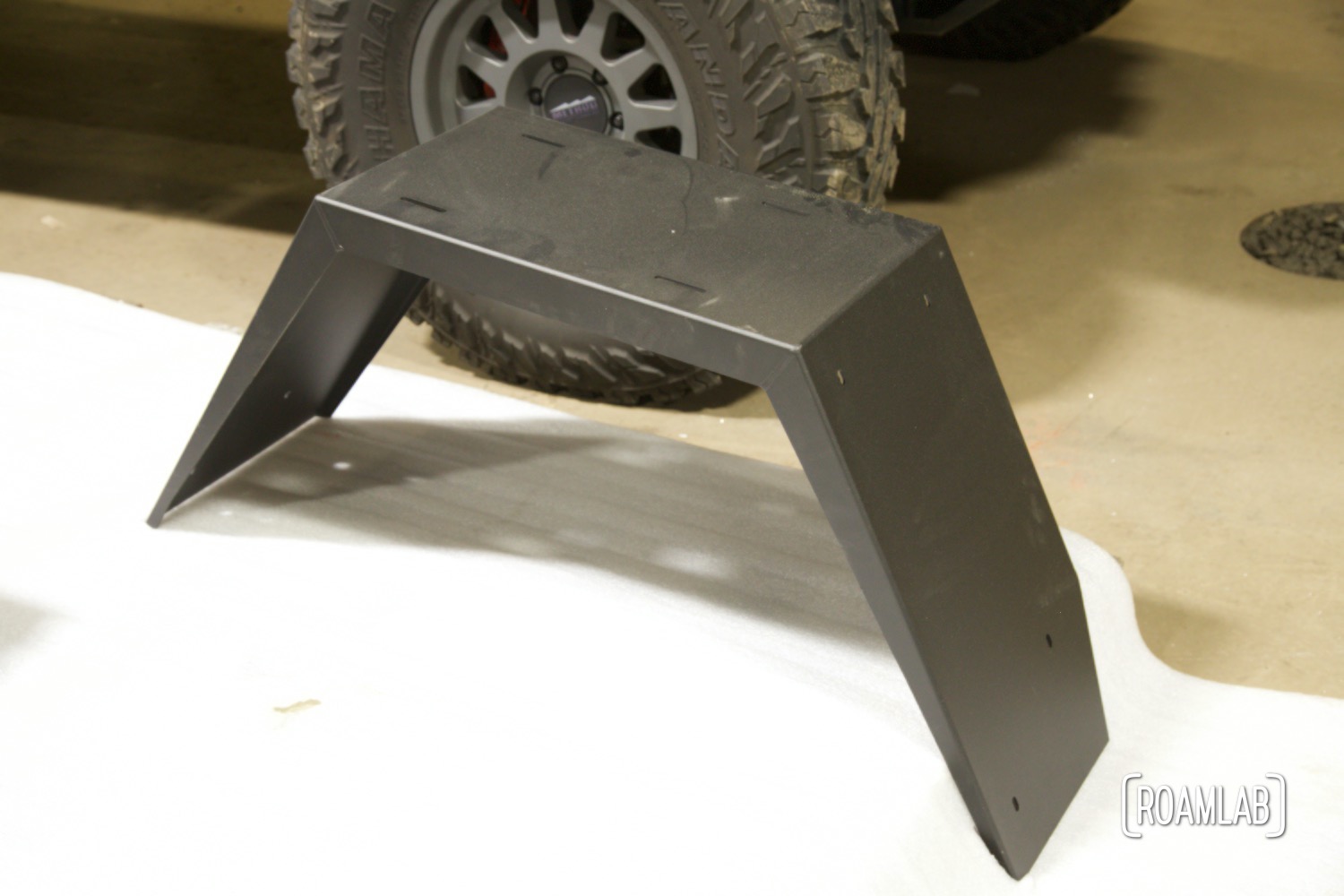 Place powder coated fender sitting on foam covering.