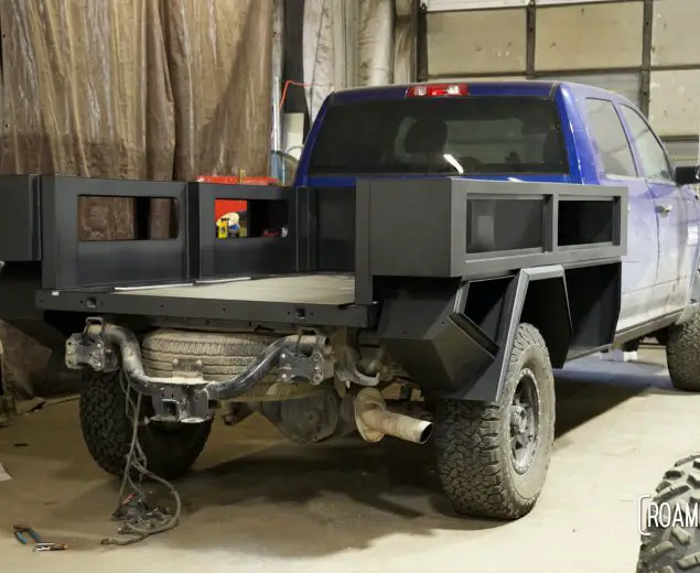 Wide view of partially constructed black truck bed.