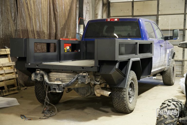 Wide view of partially constructed black truck bed.