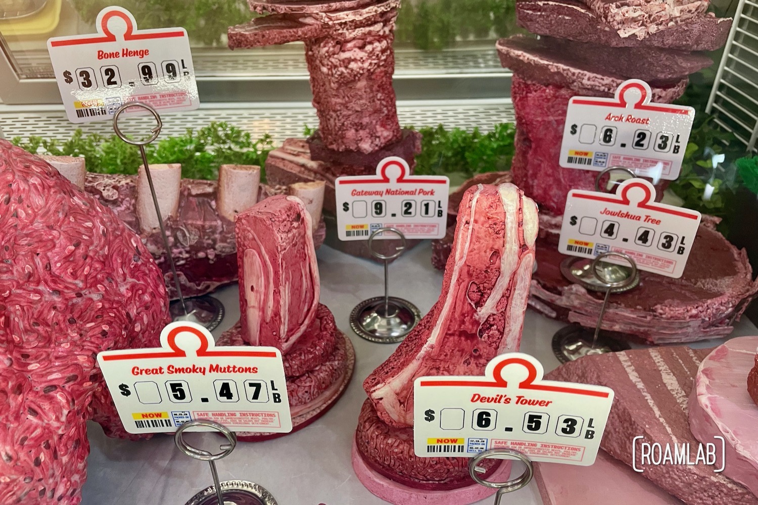 Meat cuts in the form a iconic rock formations in the "Monumental Meats" section of the Omega Mart meat counter.