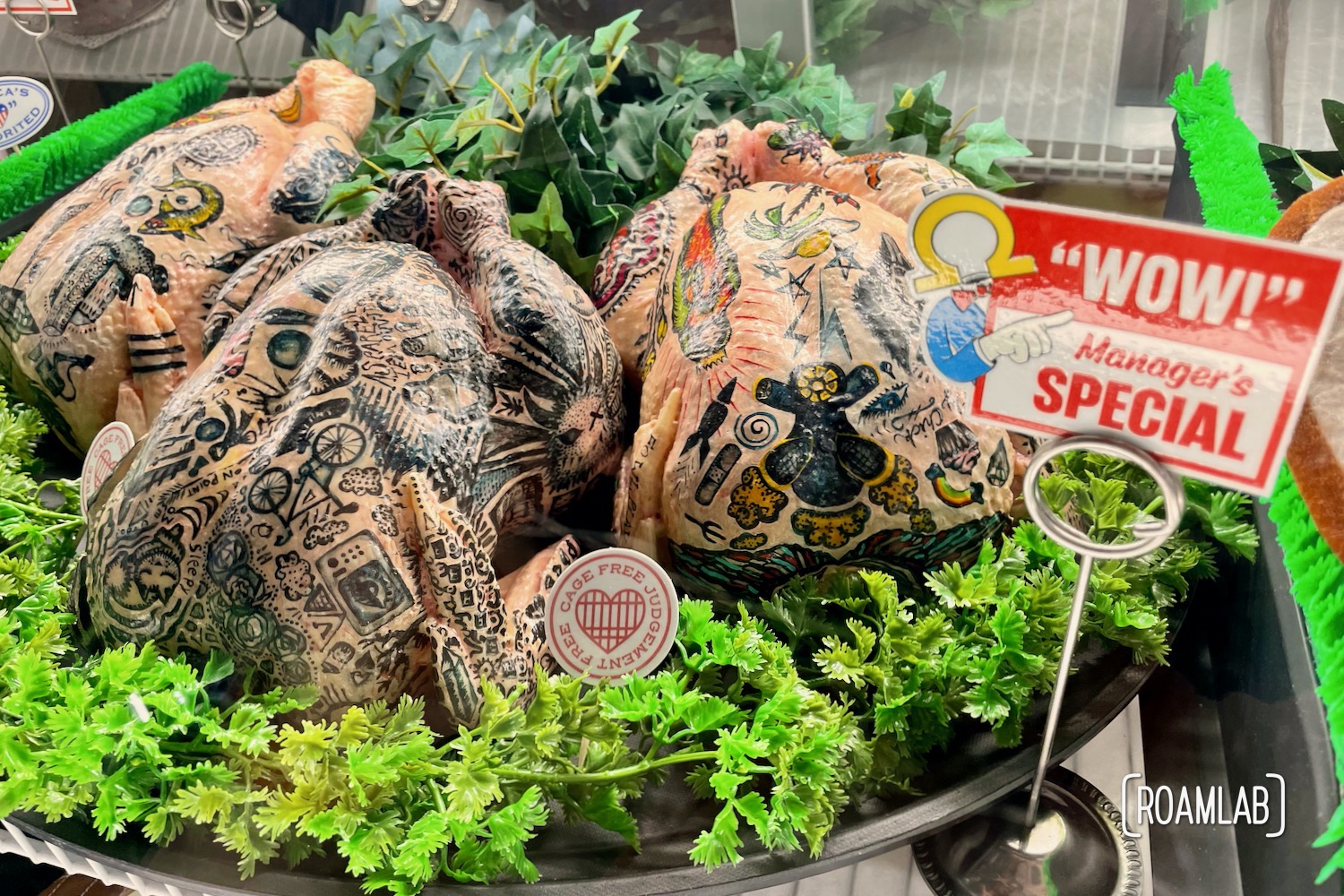 Three tattooed chickens behind the meat counter in Omega Mart, Meow Wolf's Las Vegas location.